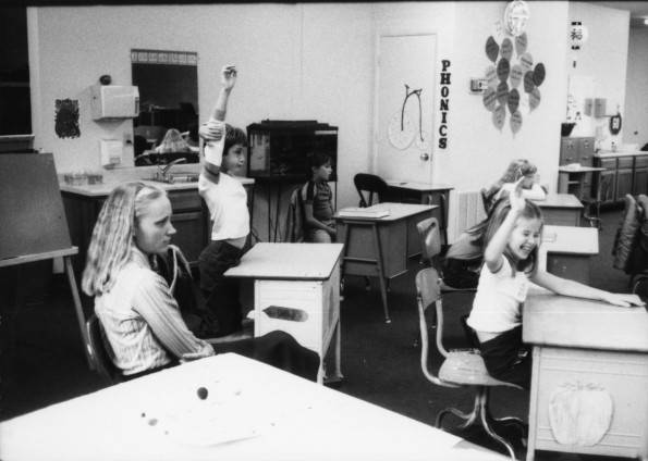 Eva Hill with her class listening to a presentation by a visiting forest ranger
